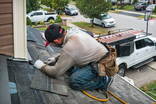 Professional Storm Damage Roof Repair technician working in Howard, OH